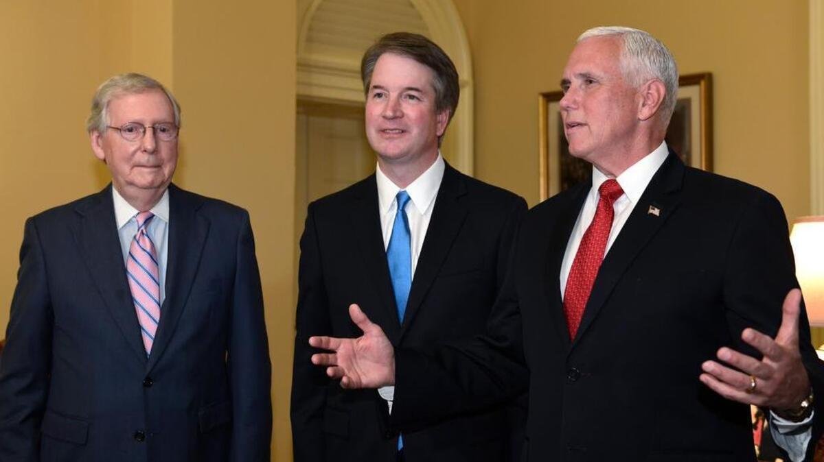 Vice President Mike Pence, right, speaks about Supreme Court nominee Brett Kavanaugh, center, as Senate Majority Leader Mitch McConnell, left, listens during a visit to Capitol Hill on Tuesday.