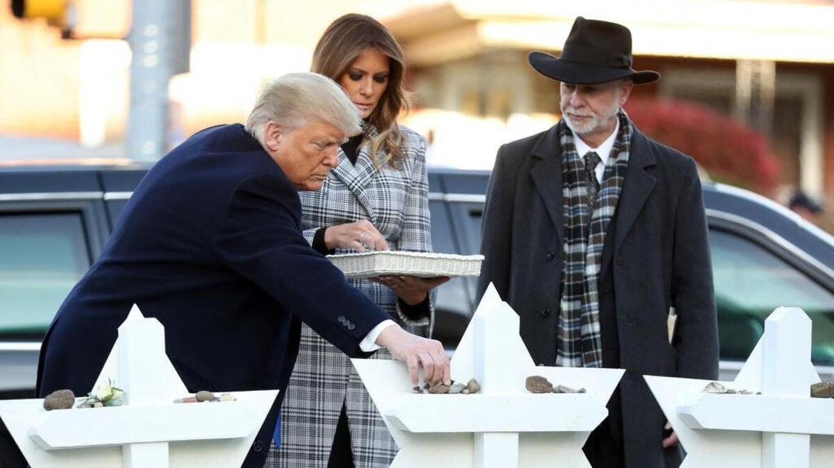 President Donald Trump and first lady Melania Trump put down stones from the White House on Tuesday at a memorial for those killed at the Tree of Life Synagogue in Pittsburgh.
