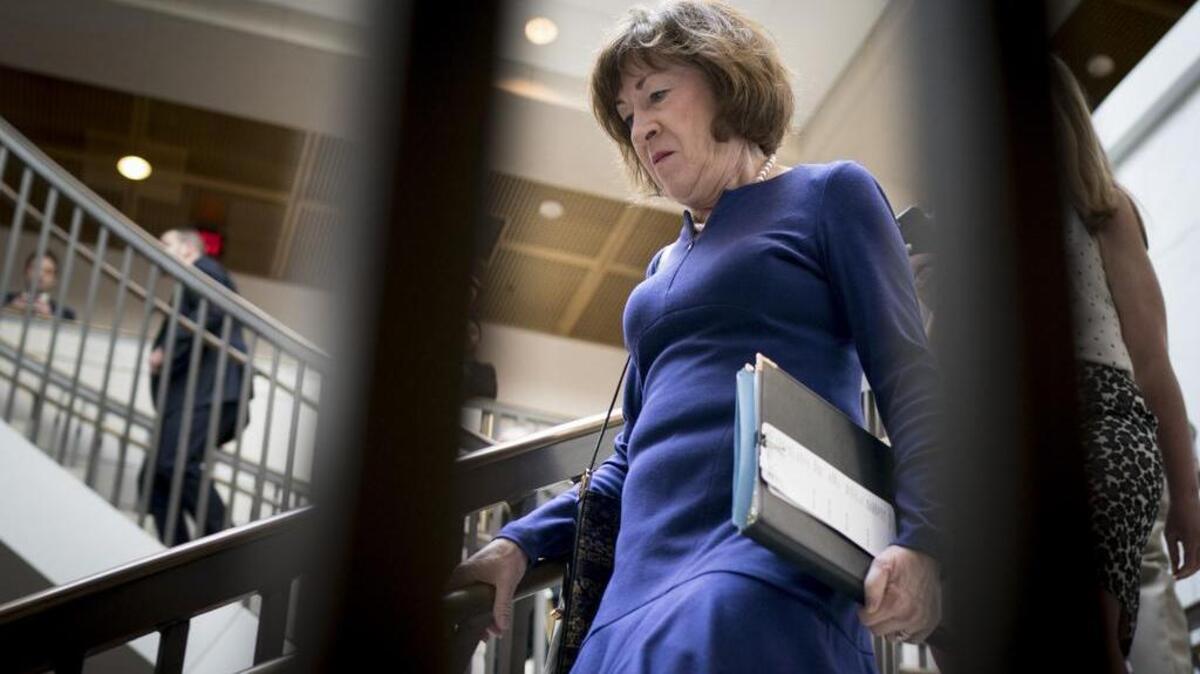 Sen. Susan Collins, R-Maine, walks Thursday to the room that holds the single copy of the FBI investigation into sexual assault allegations against Judge Brett Kavanaugh.