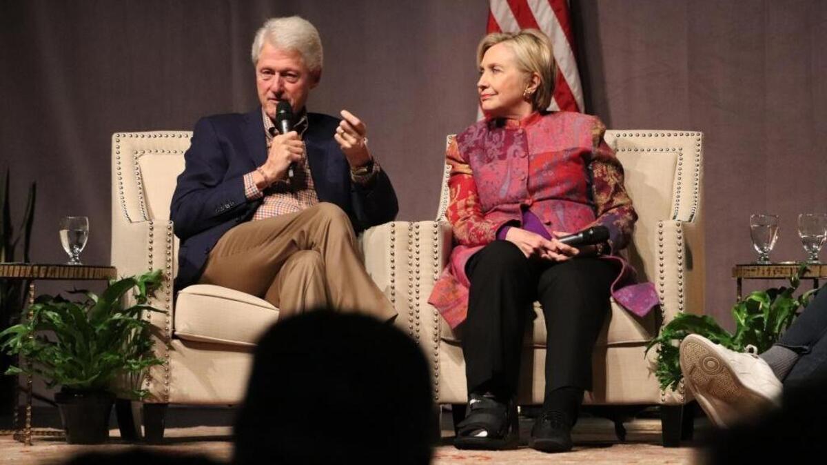 Former President Bill Clinton, accompanied by Hillary Clinton, speaks at a gathering in Little Rock, Ark., on Saturday, marking 25 years since his election.