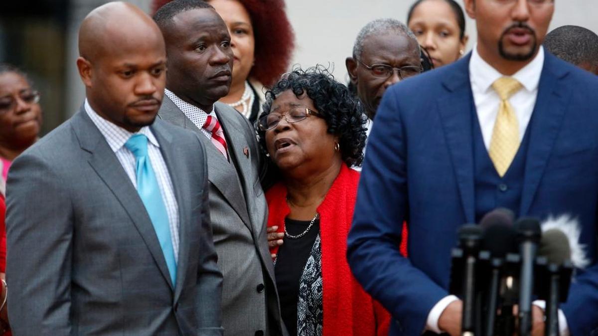 Judy Scott, center, Walter Scott’s mother, is comforted as the family’s attorneys hold a press conference Monday after a mistrial was declared in his slaying. Michael Slager, a white former police officer, was charged in the death in Charleston, S.C.
