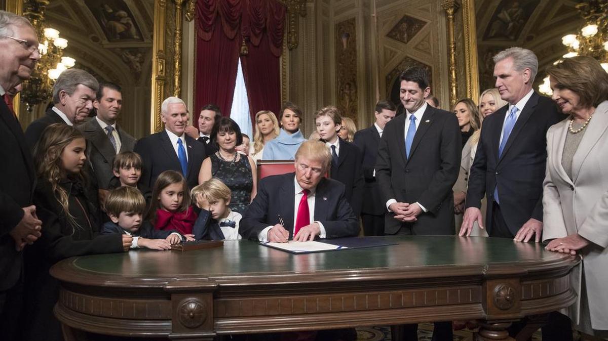 President Donald Trump is joined by the Congressional leadership and his family as he formally signs his cabinet nominations into law, Friday, Jan. 20, 2107. With a new president and new majority party in power, we need to find a way to reach considered compromise? This is how not to achieve compromise: labeling the ascendant party as illegitimate. Pledging, even before the new government assumes control, to fight it.