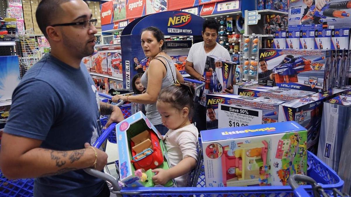 Shoppers scramble for Black Friday deals at a Toys R Us in Doral, Fla., in November 2017.