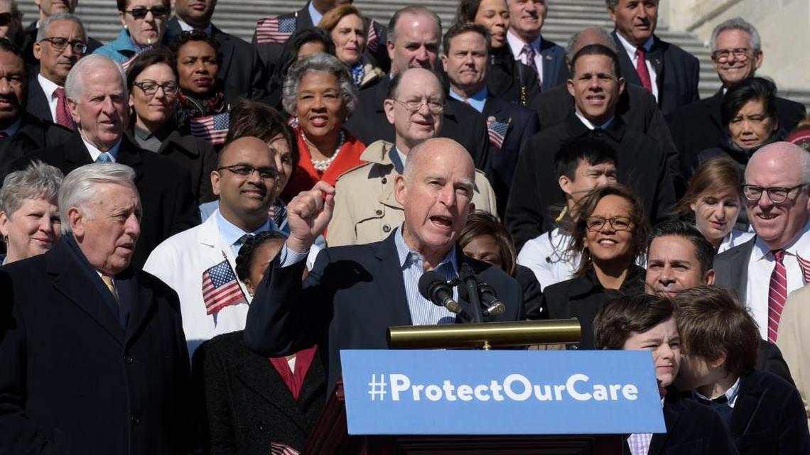 California Gov. Jerry Brown speaks on Capitol Hill during an event marking seven years since former President Barack Obama signed the Affordable Care Act into law.