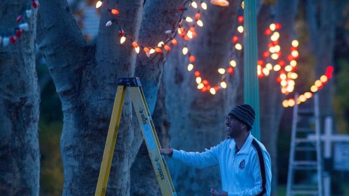 Ernesto Belmonte installs Christmas lights in his Sacramento front yard on Nov. 28. California’s role in modeling our ideas of what Christmas should be like gets overlooked, says commentator Joe Mathews.
