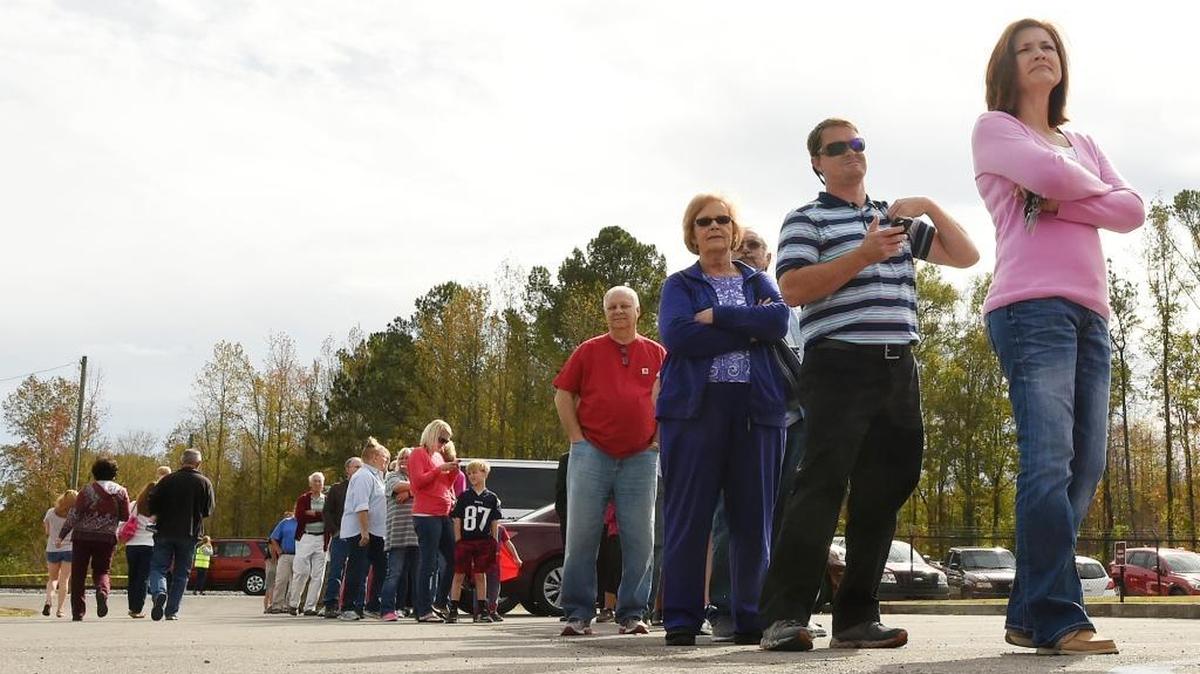 A polling place in Springville, Ala., shows heavy voter turnout Tuesday, Nov. 8, 2016. Lines ran out through the parking lot into the street. The turnout of minorities continue to lag behind white voters.