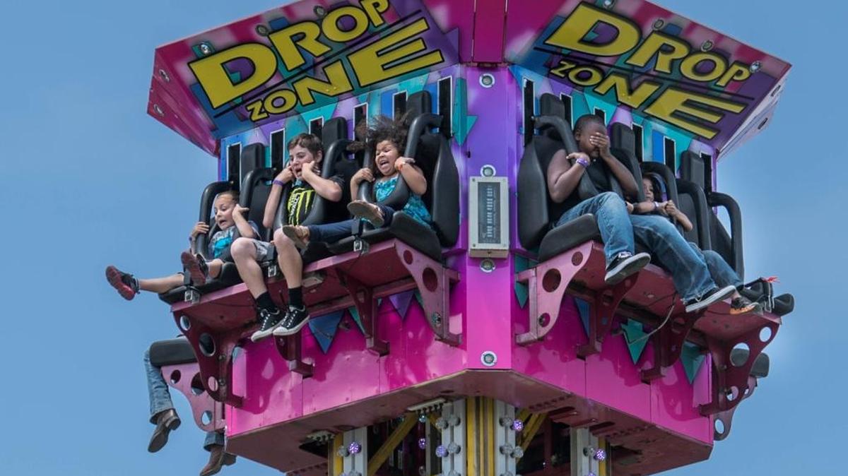 Fairgoers ride the “drop zone” at the Sacramento County Fair in May.