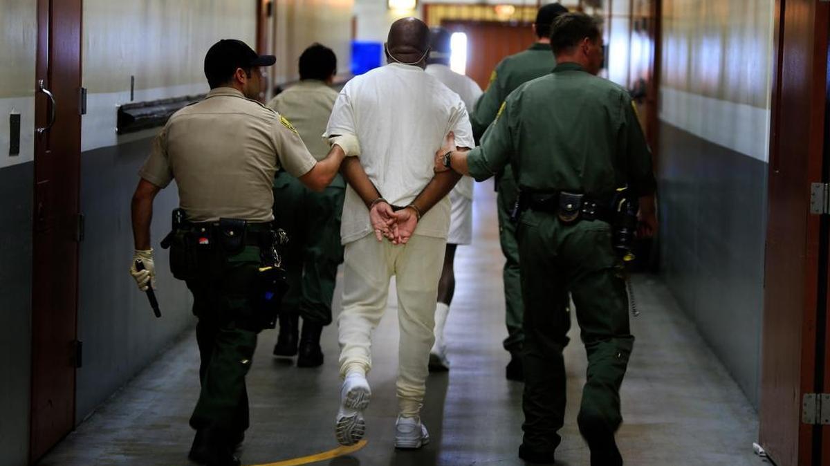 Inmates are walked from their cells in the Secure Housing Units in Pelican Bay State Prison to the medical unit in 2013. A September 2015 settlement in a class-action lawsuit limited long-term solitary confinement in California prisons.