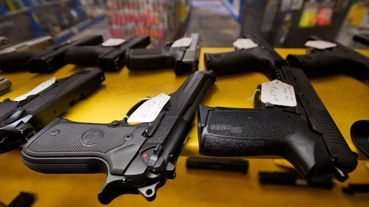 Handguns fill a display case at a gun shop in North Highlands.