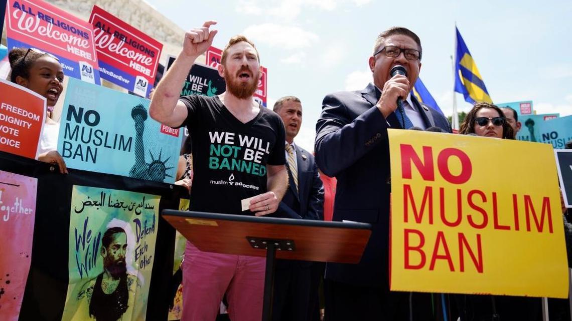 Rep. Salud Carbajal, D-Calif., right, joined by Johnathan Smith of Muslim Advocates, speaks during the “We Will Not Be Banned” protest sponsored by Muslim Advocates outside the Supreme Court on Capitol Hill in in Washington, Tuesday, June 26, 2018. They are protesting the Supreme Court ruling upholding President Donald Trump’s travel ban. (AP Photo/Carolyn Kaster)