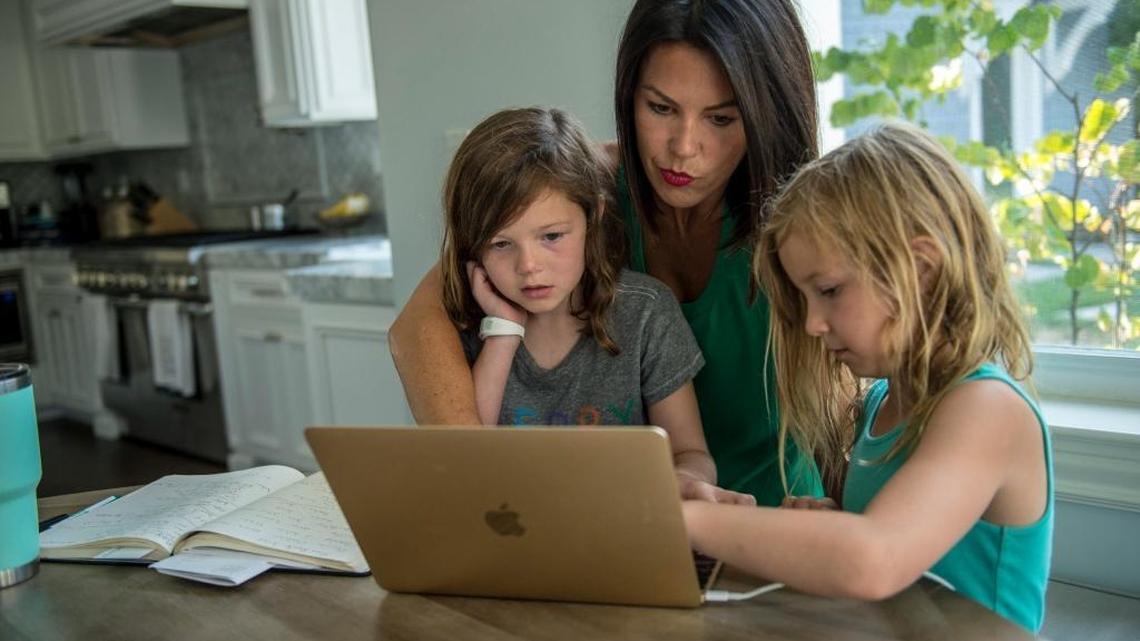 Ashely Hutton says working as an independent contractor allows her flexible time with daughters Piper, 7, left, and Stella, 5, right. A recent California Supreme Court ruling changed the rules for contractors.