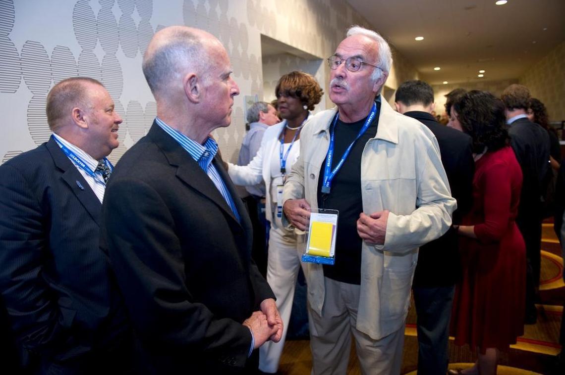 California Democratic Party Chairman John Burton, right, speaks with Jerry Brown in 2010.