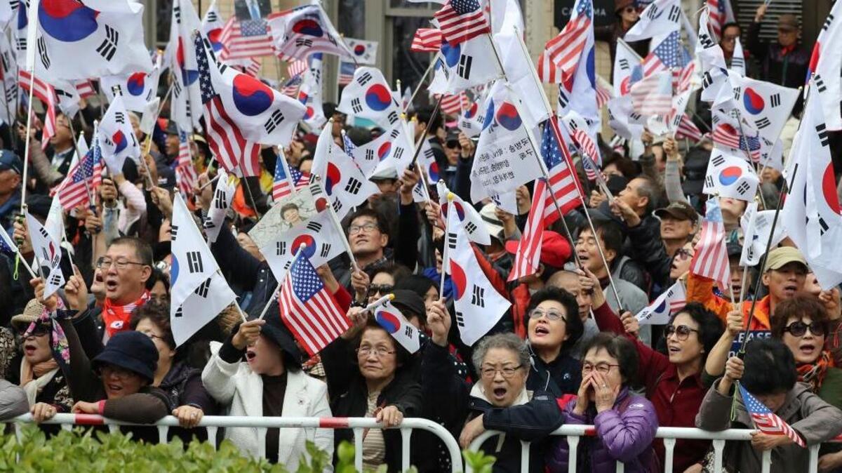 Protesters against North Korea stage a rally welcoming the visit by President Donald Trump in Seoul, South Korea on Tuesday.