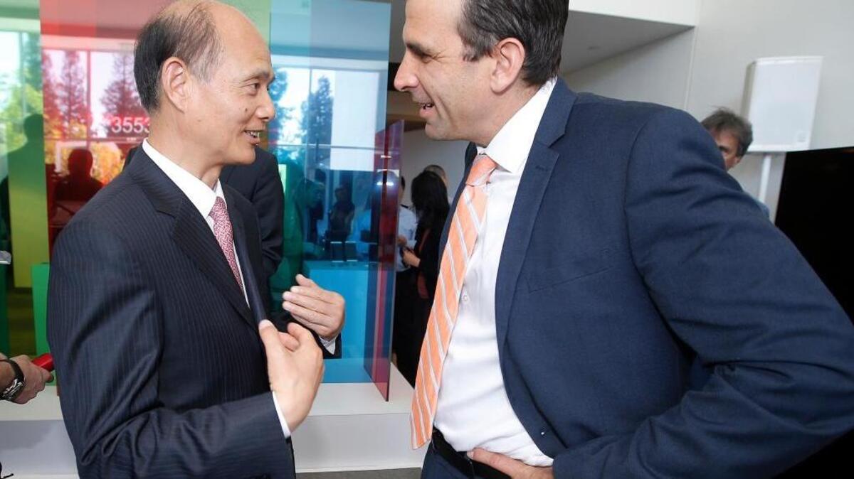 Luo Linquan, Chinese consul general in San Francisco, left, and San Jose Mayor Sam Liccardo talk during the ribbon-cutting ceremony of the new LeEco North American Headquarters facility on Thursday in San Jose. Joe Mathews writes that San Jose is losing a rivalry to San Francisco.