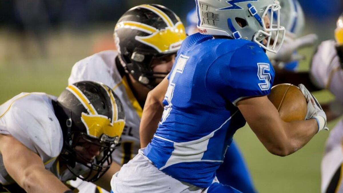 Del Oro’s defense tackles Rocklin’s Evyn Holtz during the section championship game Dec. 4. Del Oro plays for a state title on Friday.