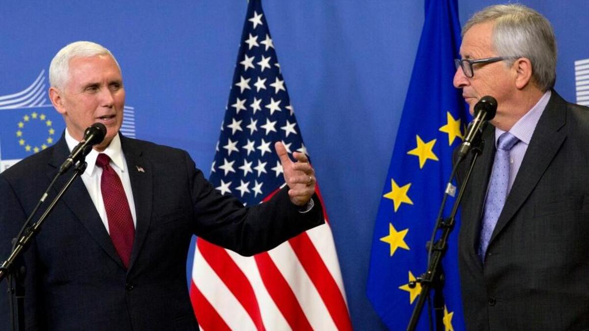 Vice President Mike Pence, left, and European Commission President Jean-Claude Juncker speak to reporters before meeting at EU headquarters in Brussels on Monday.
