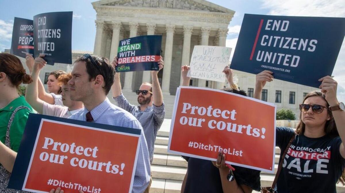 Activists rally at the U.S. Supreme Court on Thursday as President Donald Trump prepares to choose a replacement for Justice Anthony Kennedy.