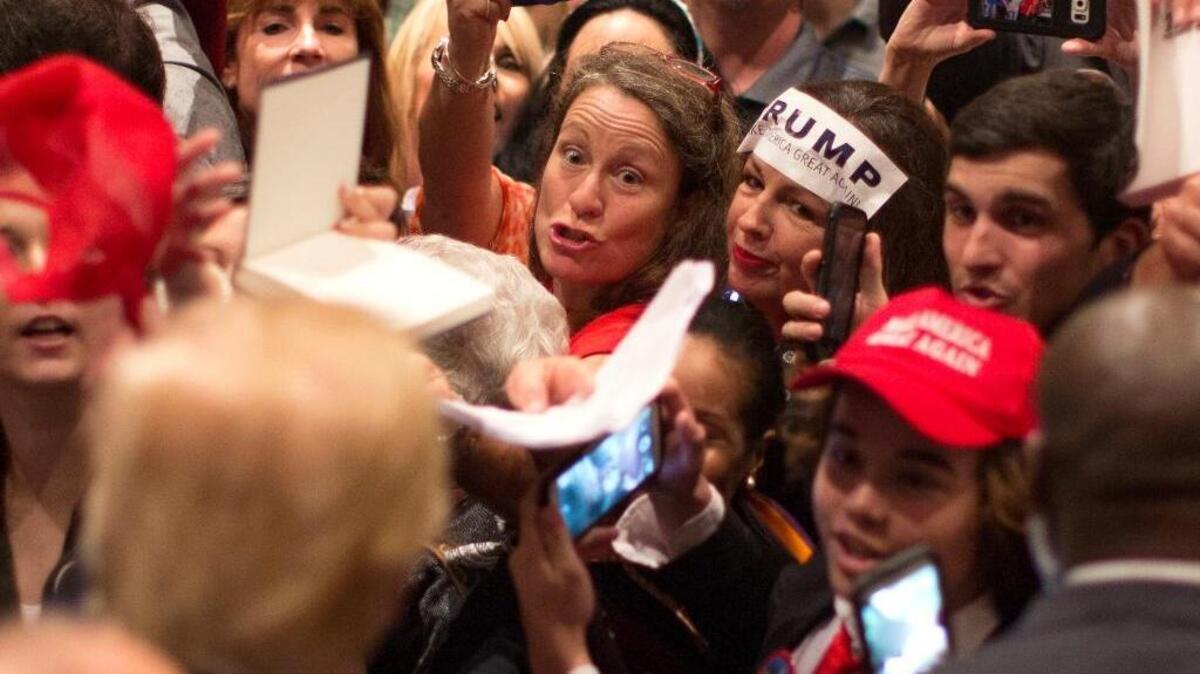 Supporters clamor for Republican presidential candidate Donald Trump’s autograph during a campaign stop in Hilton Head Island, S.C., on Wednesday. Will the big crowds at rallies translate into votes?
