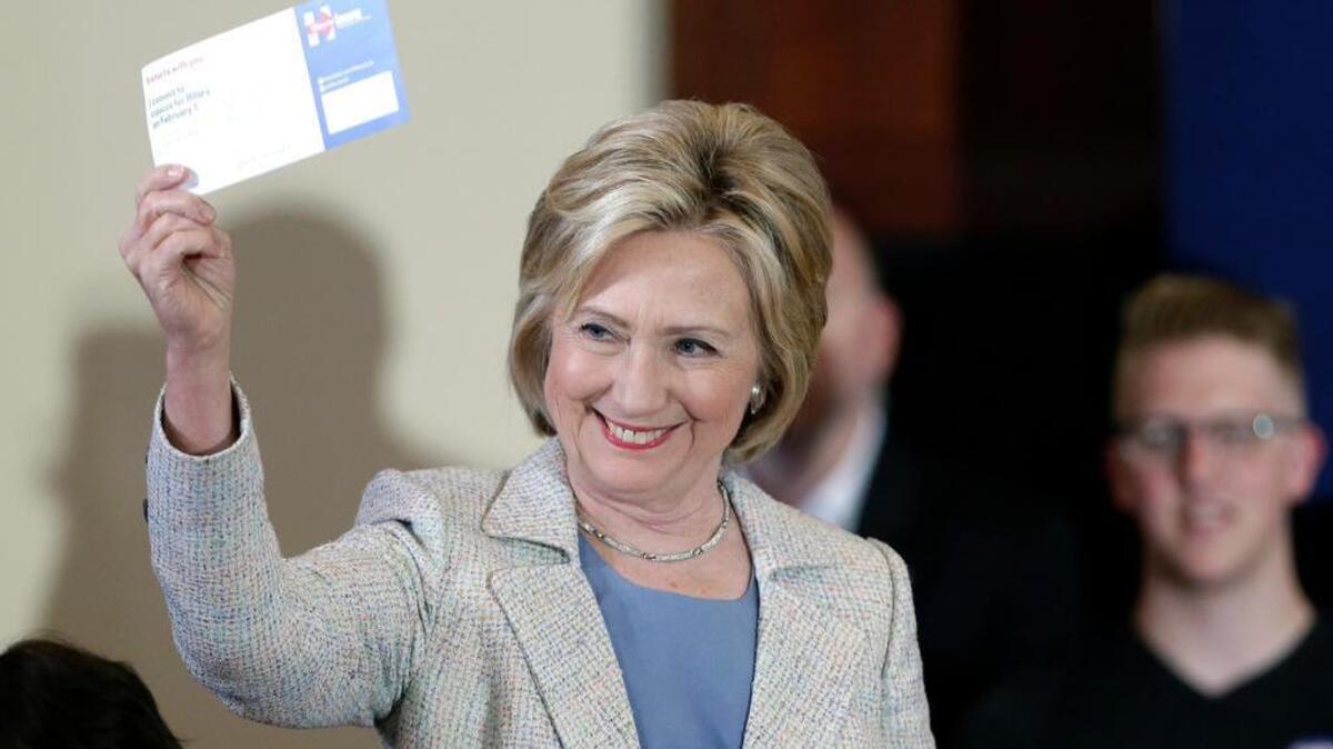 
Democratic presidential candidate Hillary Rodham Clinton holds a commit to caucus card during a campaign event July 26 at Iowa State University. Joe Mathews says that the Central Coast would be a better place for the first-in-the-nation caucus. 
