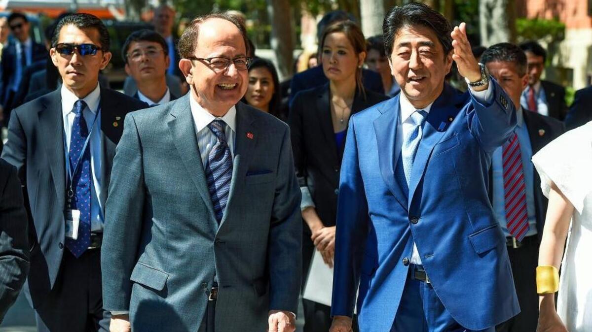University of Southern California President C.L. Max Nikias, left, gives Japanese Prime Minister Shinzo Abe a tour of the USC campus in May. Joe Mathews says public universities should try to copy USC’s bold initiatives.
