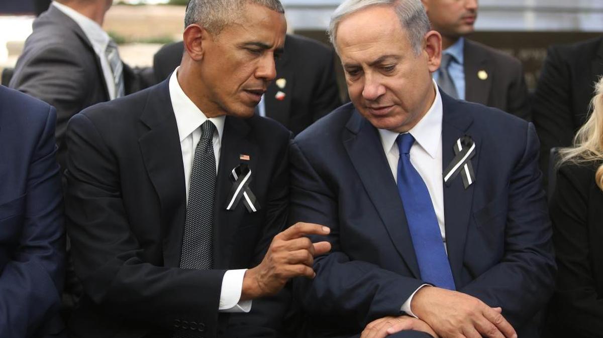 President Barack Obama, left, and Israeli Prime Minister Benjamin Netanyahu talk during the funeral of former Israeli President Shimon Peres in Jerusalem on Sept. 30, 2016.