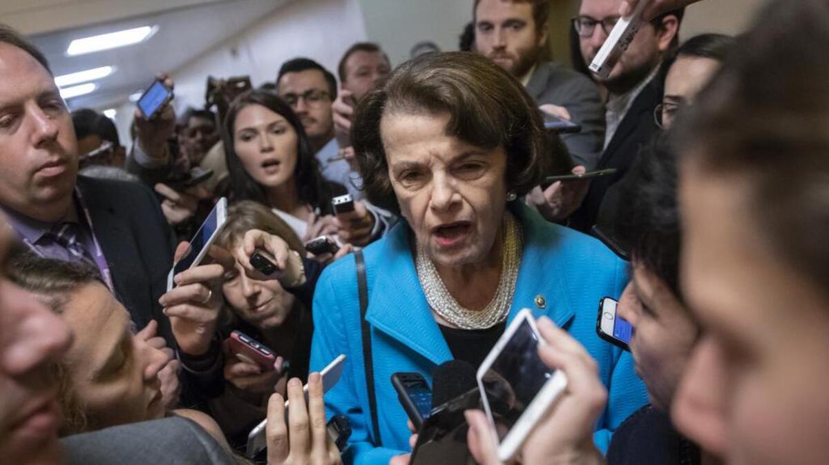 Sen. Dianne Feinstein of California, the ranking Democrat on the Senate Judiciary Committee, responds to reporters’ questions on Supreme Court nominee Brett Kavanaugh on Tuesday.