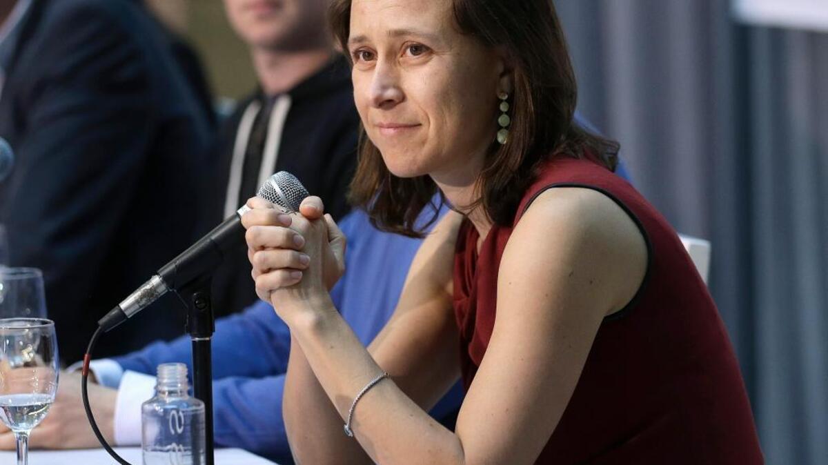 Anne Wojcicki, CEO of 23andMe, speaks at a 2013 announcement for the Breakthrough Prize in Life Sciences at UC San Francisco. The genetic testing company said last week that it has received federal approval to reintroduce some health-screening tools.