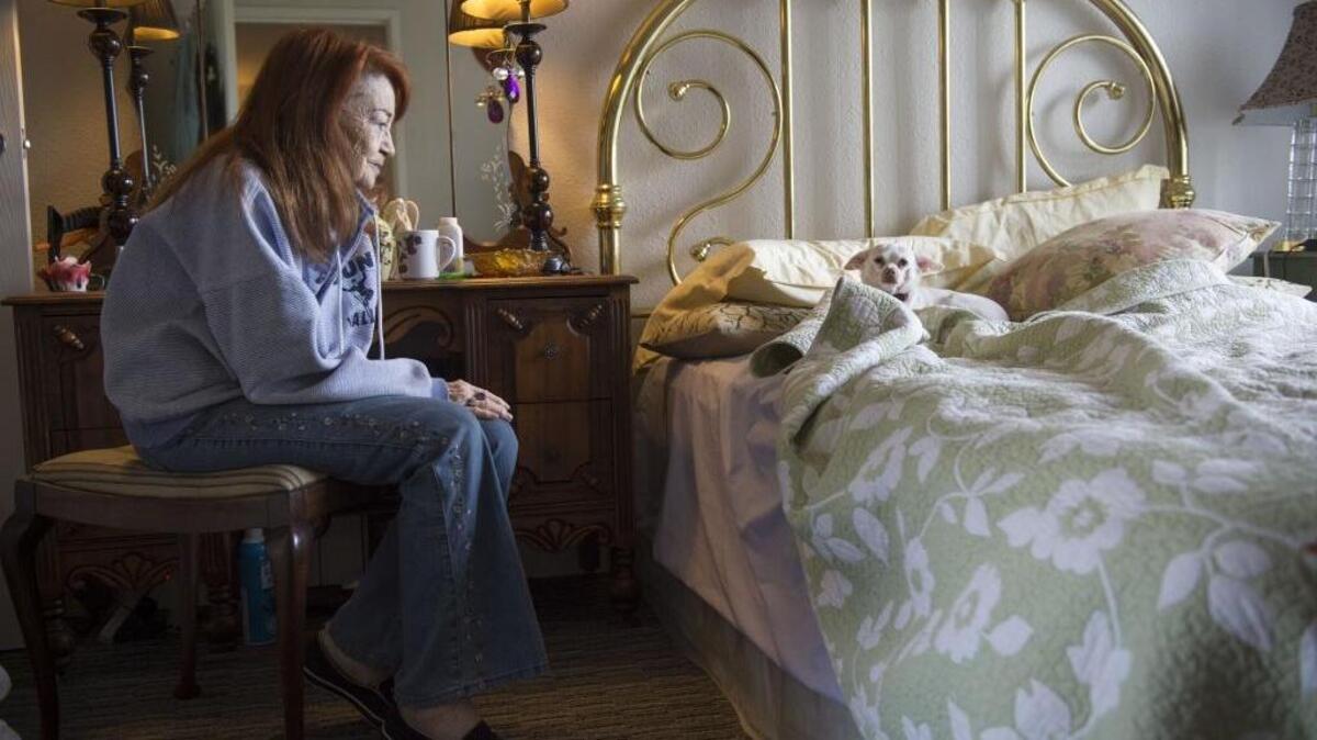 Faye Duncan sits in her bedroom at her midtown Sacramento apartment community serving low-income seniors. She said she was on a waiting list for 18 months.