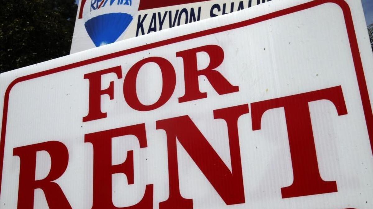 A “For Rent” sign sits in front of a home in Los Angeles.
