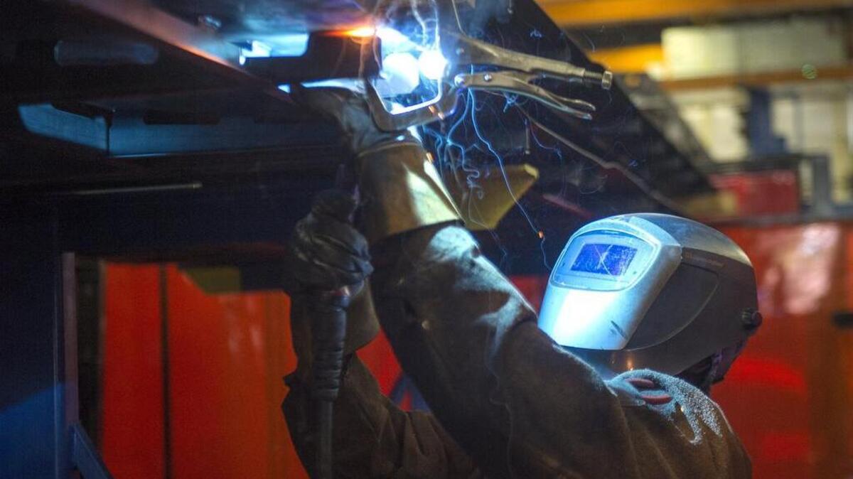 Anzio Taylor welds the roof section of a light rail car at the Siemens factory in Sacramento last October. California is losing manufacturing jobs.