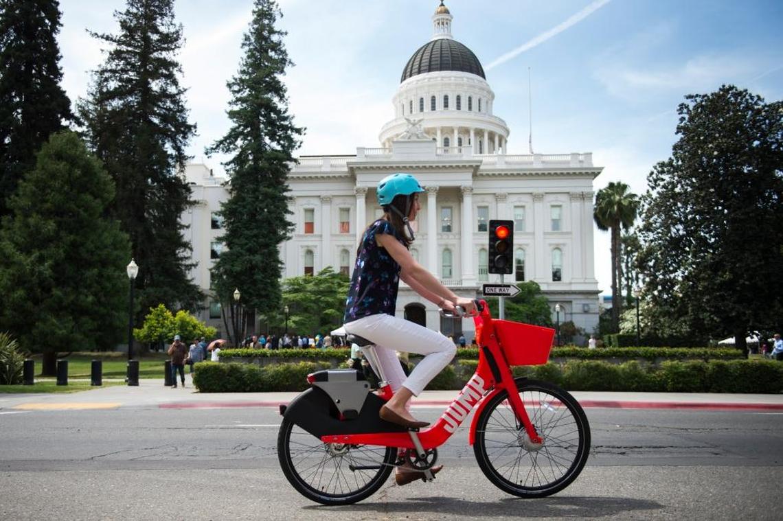 Chelsea Payne tries out one of the new Jump rental bikes available in Davis, Sacramento and West Sacramento. In West Sacramento, they are only one part of a new way to look at public transit.