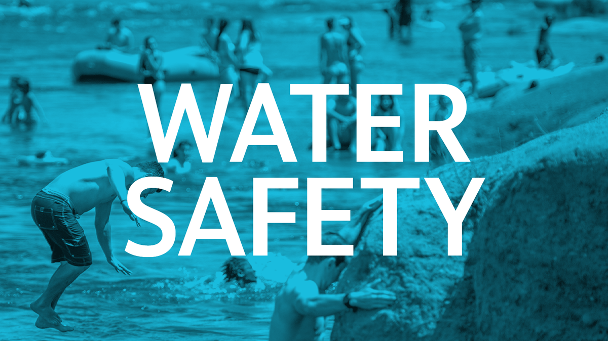 Image depicts swimmers and others along a river