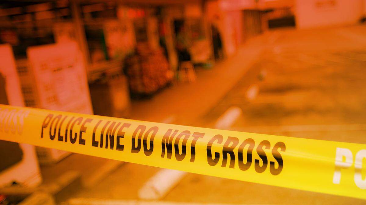 Police tape blocks entrance to a convenience store in San Luis Obispo County.
