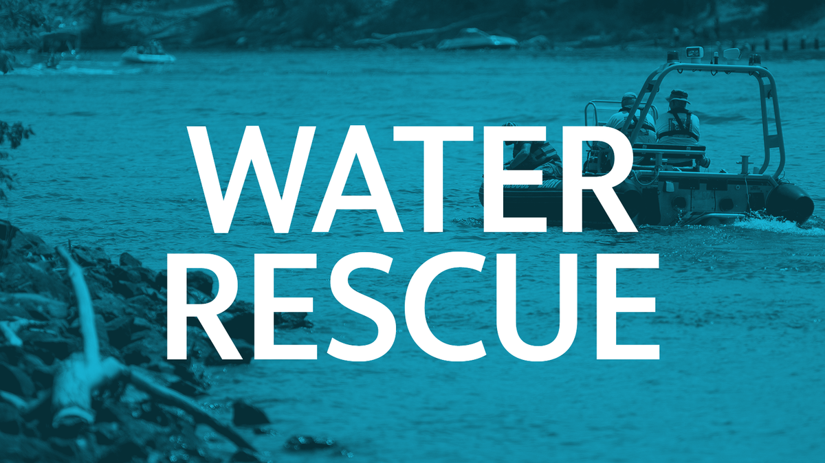 River rescue incident depicts emergency personnel in boats on water