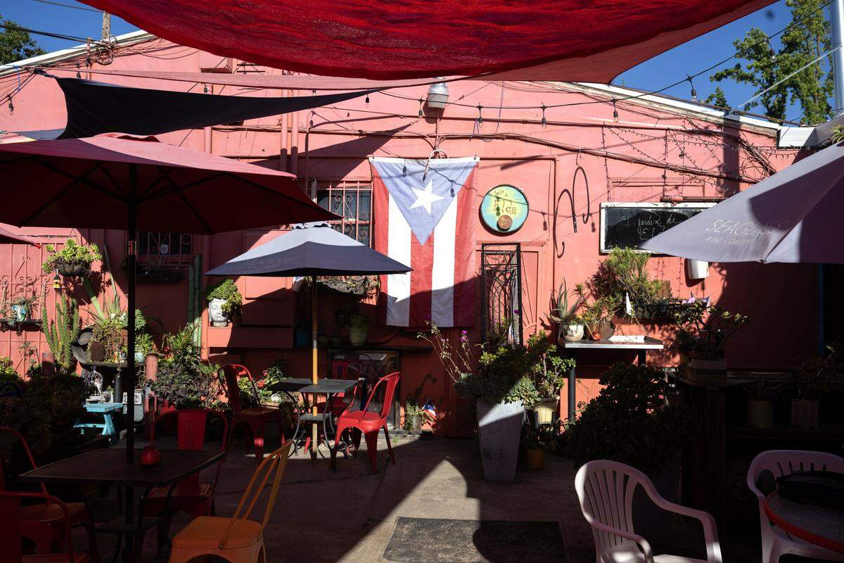 A Puerto Rican flag hangs in the patio at Lola’s Lounge on 16th Street in Sacramento on Wednesday.