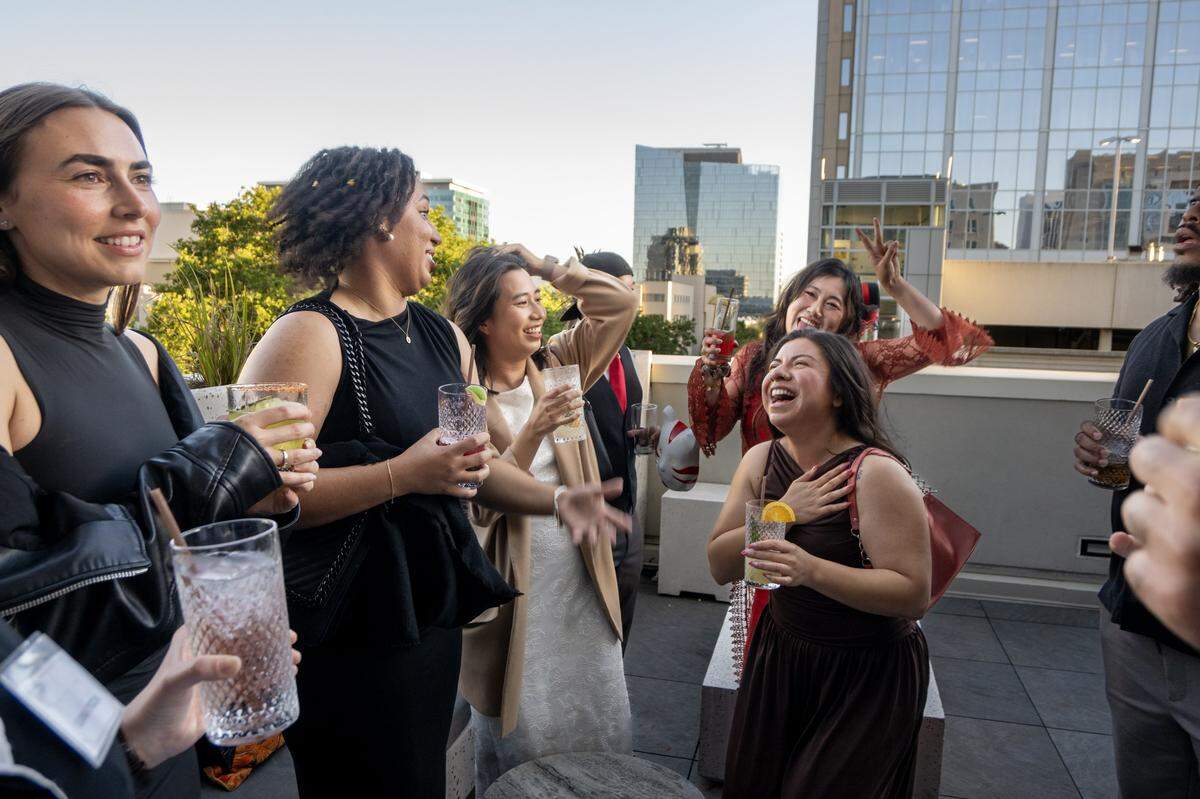 Ellie Vasquez, center, celebrates with her friends during her 30th birthday celebration at the rooftop bar at the Clayton Club in downtown Sacramento earlier this month. 