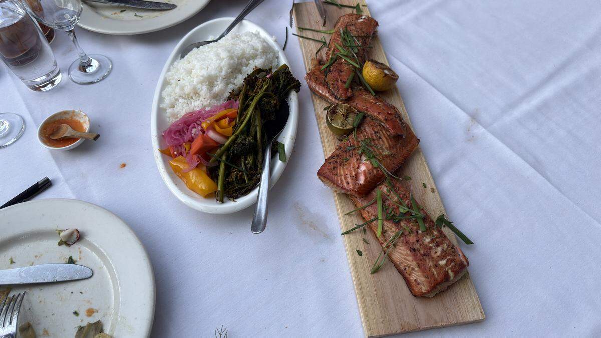 Ferrari Fisheries’ wild-caught California King salmon was cooked on cedar planks and served with white rice, broccolini and Japanese-style pickles at Mulvaney’s B&L at 1215 19th St. on Monday, May 18, 2026.