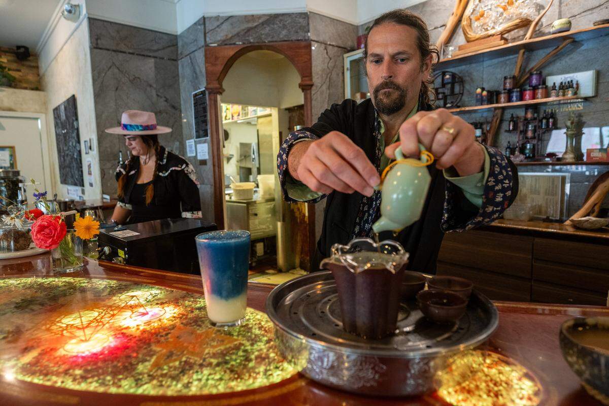 Colter Merrick, owner of Elixart, serves a variety of plant-based teas from around the world at his mocktail bar and lounge in Nevada City on May 28.
