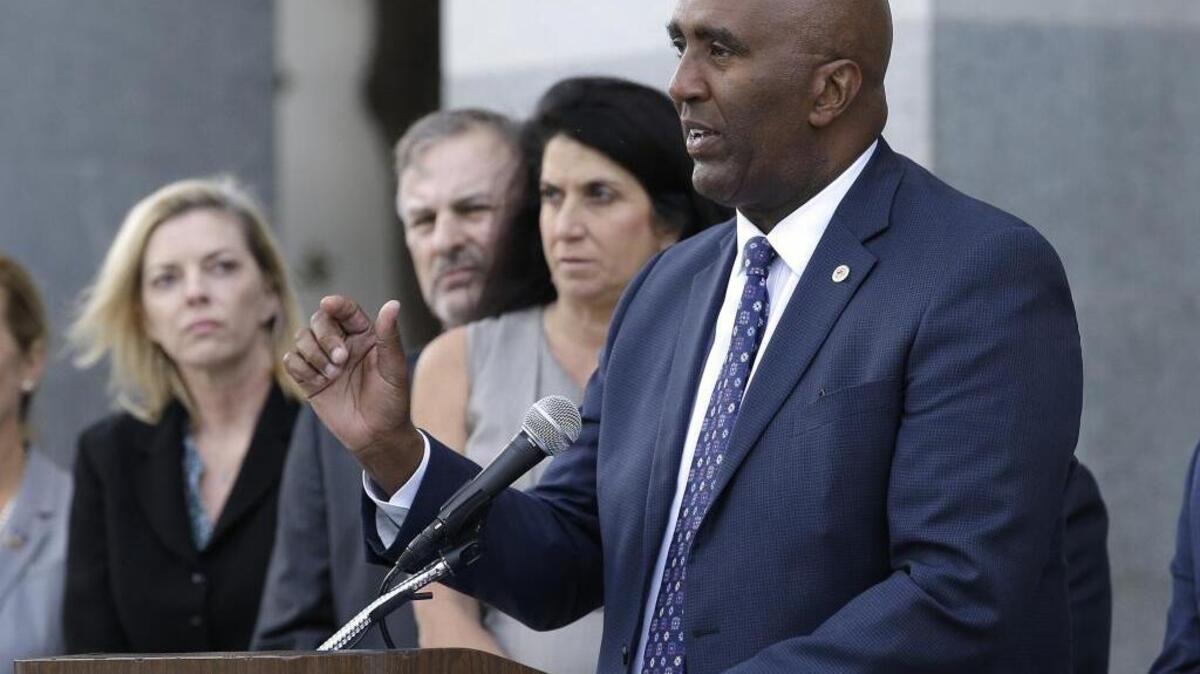 Assemblyman Jim Cooper, D-Elk Grove, right, outlines his proposed ballot initiative that would expand the list of violent crimes and make other changes to a recent series of laws intended to lower the state’s overcrowded prison population.
