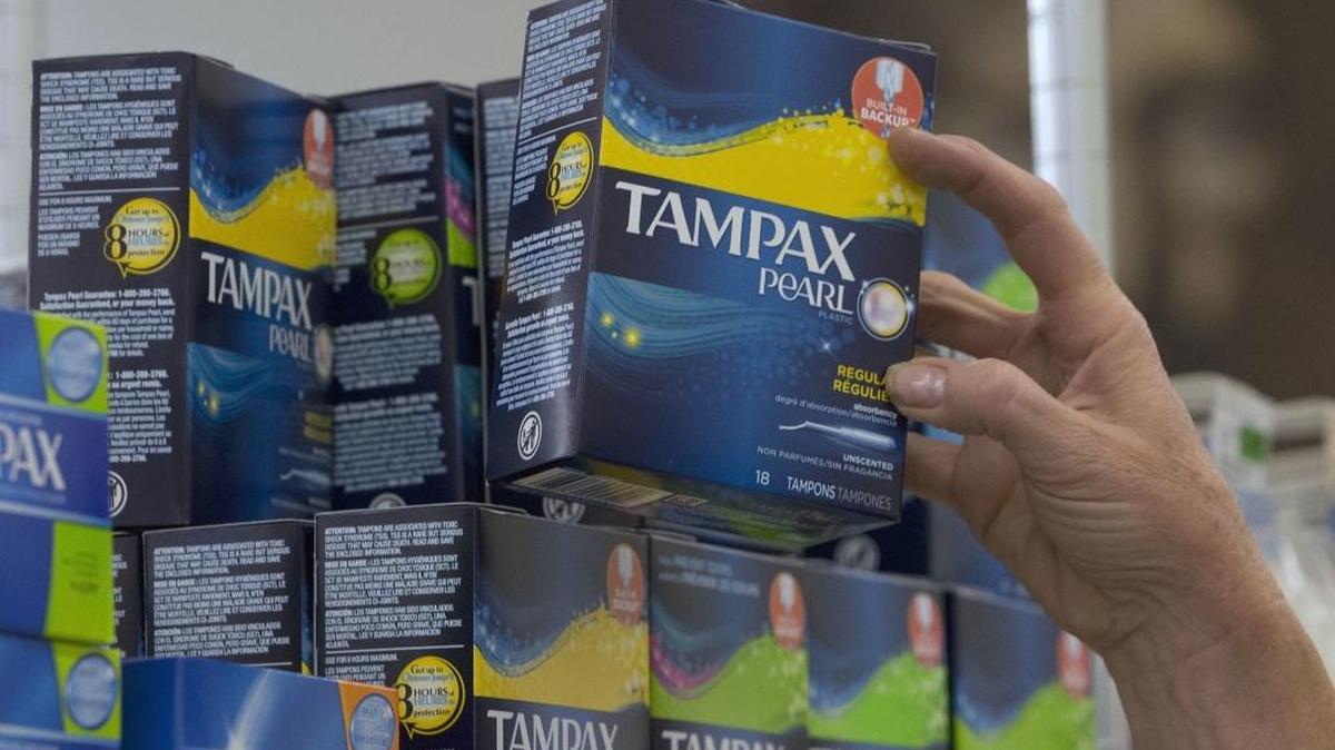 Tammy Compton restocks tampons at Compton’s Market, in Sacramento, on June 22, 2016.