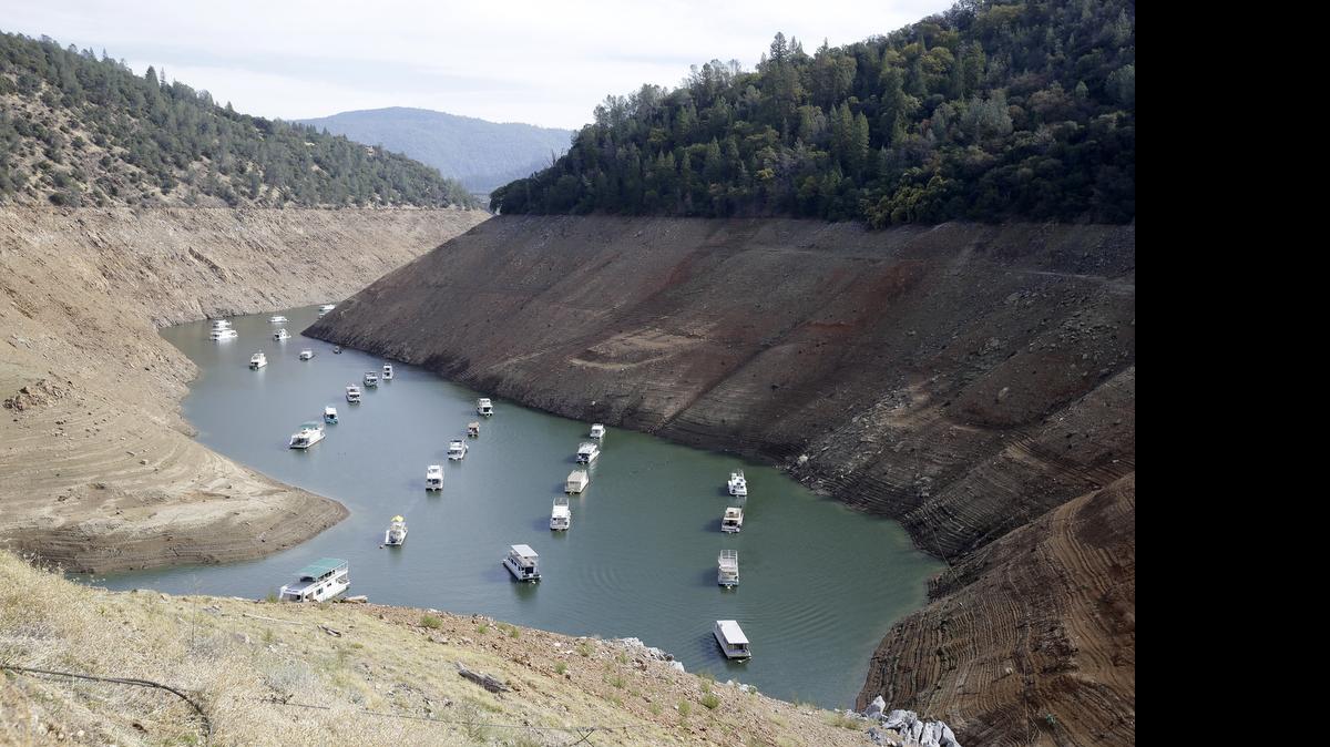 
In this Thursday, Oct. 30, 2014 file photo, houseboats sit in the drought-lowered waters of Oroville Lake, near Oroville, Calif. 
