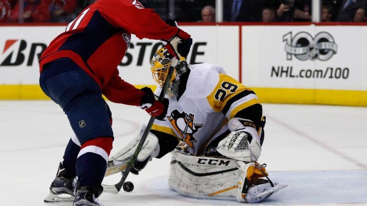 Washington Capitals center Lars Eller can’t get the puck past Pittsburgh Penguins goalie Marc-Andre Fleury during the second period of Game 7 of an Eastern Conference semifinal Wednesday in Washington. The Penguins won 2-0.