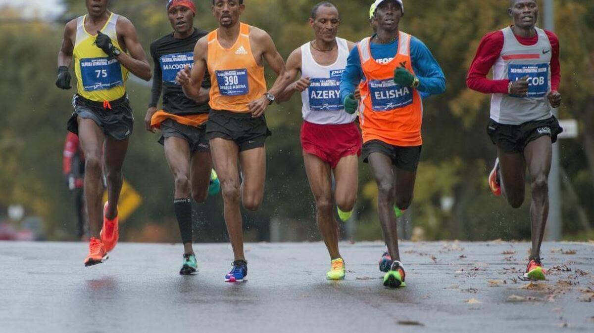 The lead runners race down the course during the California International Marathon Sunday on December 6, 2015 in Sacramento.