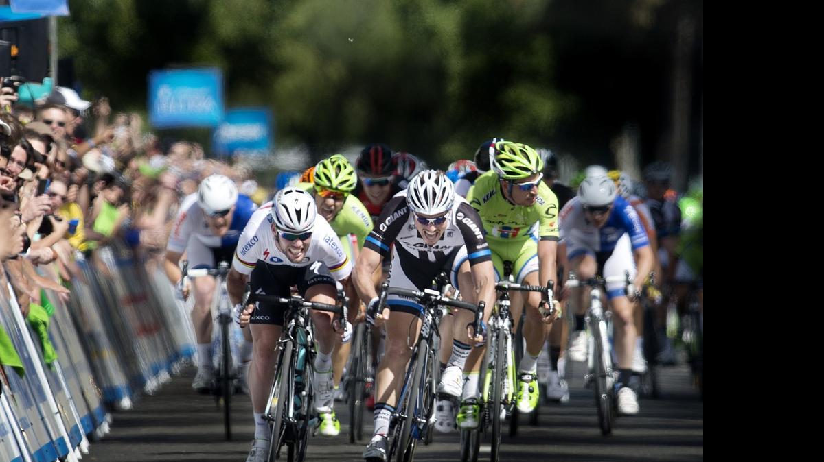 
Riders push hard to the finish of Stage 1 of the 2014 Tour of California, sprinting for home in downtown Sacramento. The 2015 men’s race again opens in the capital.
