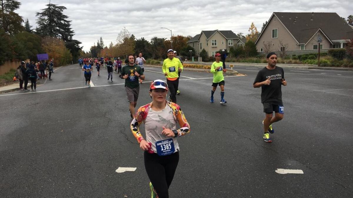 Runners at Fair Oaks and Eastern Avenue for the California International Marathon on Sunday, December 6, 2015.