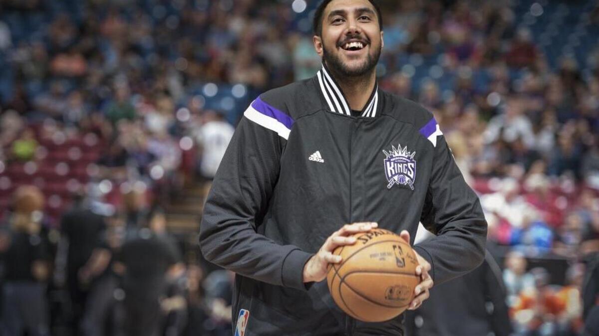 Kings center Sim Bhullar warms up before a game against the New Orleans Pelicans at Sleep Train Arena on April 3, 2015. Bhullar, now in the Chinese National Basketball League, recently tried to help stop fighting during a massive brawl in a playoff game.