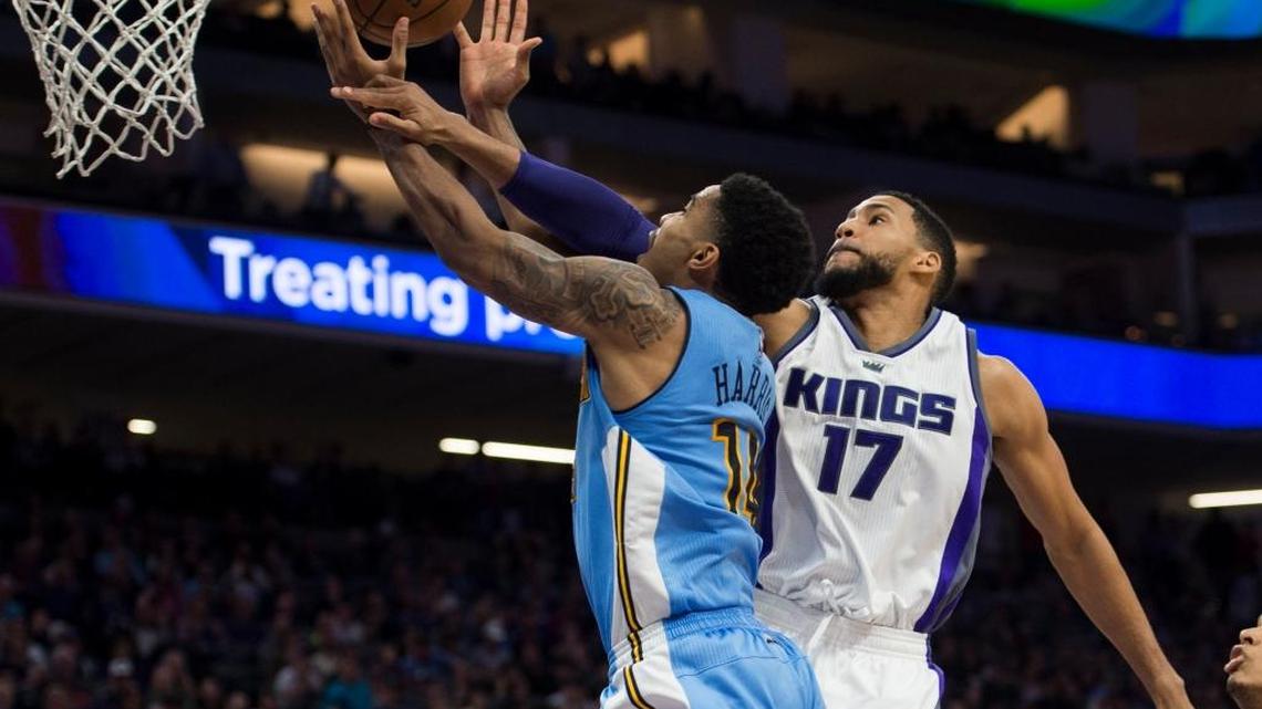 Sacramento Kings guard Garrett Temple (17) fouls Denver Nuggets guard Gary Harris during the fourth quarter on Saturday, March 11, 2017, at Golden 1 Center in Sacramento, Calif.