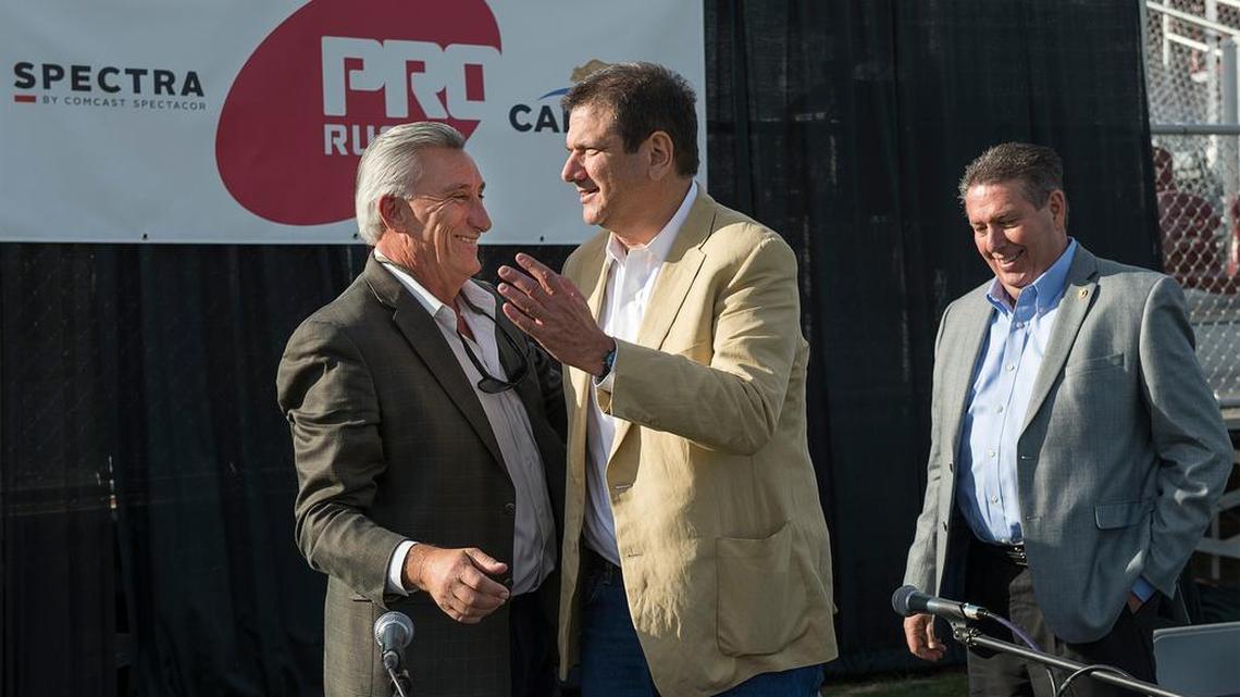 Nick Nicora, a vice president of concessionaire Spectra, left, congratulates PRO Rugby CEO Douglas Schoninger after Tuesday’s announcement of Sacramento’s rugby team. The team will play at Bonney Field in Cal Expo.