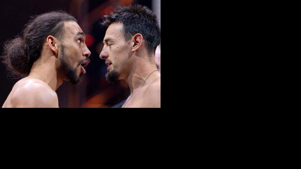 
Welterweight champion Keith Thurman, left,  and Robert Guerrero face off at the weigh-in for their fight in Las Vegas, which will be televised on NBC.
