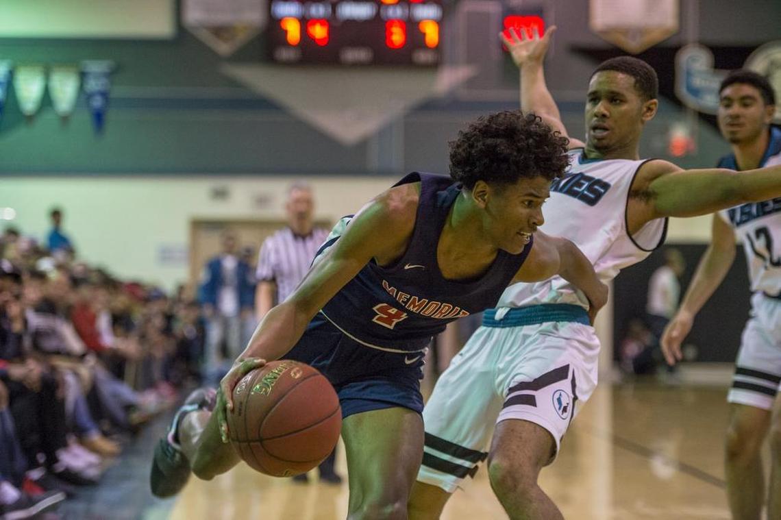 San Joaquin Memorial Panthers guard Jalen Green (C) (4) hooks Sheldon Huskies guard Dom Johnson (1) as he drives to the basket in the second half.